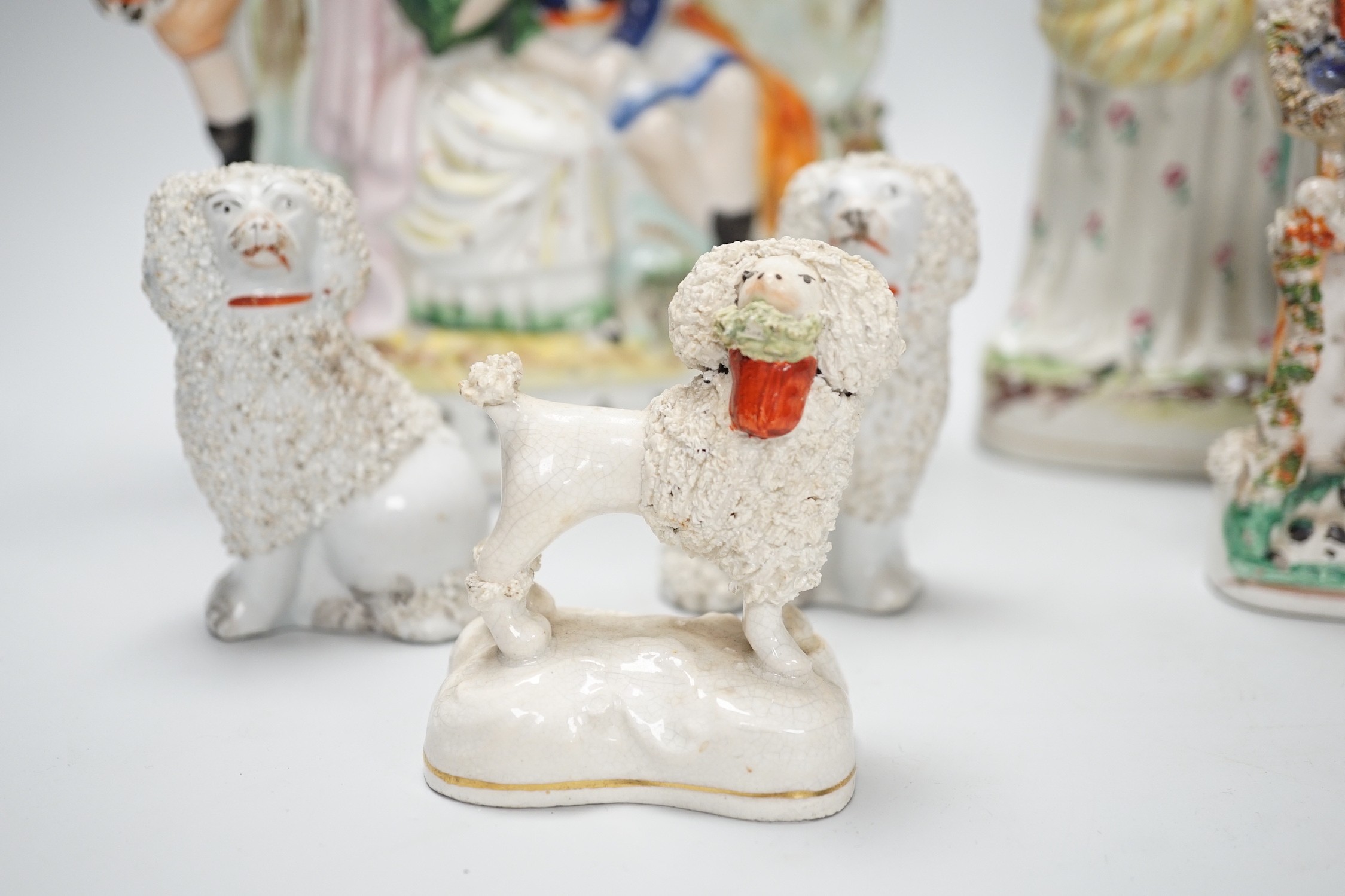 A selection of Staffordshire figure groups, greyhounds, spaniels, etc. tallest 26.5cm